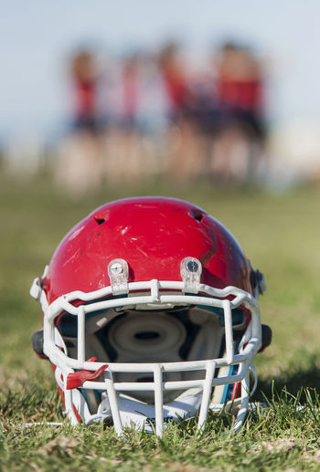 Close-up of football helmet on field