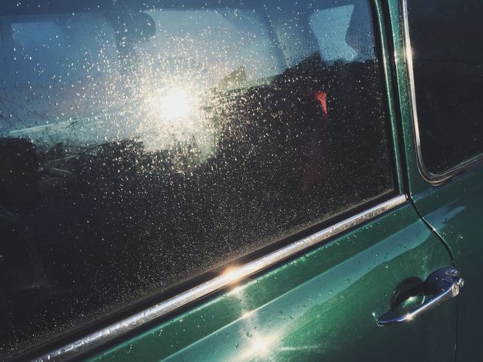 Close-up of raindrops on car window