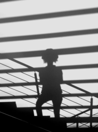 Silhouette man standing on floor
