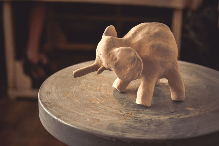 Close-up of animal sculpture on table