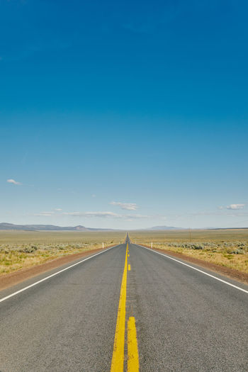 Views of an empty open road in oregon during a summer road trip.