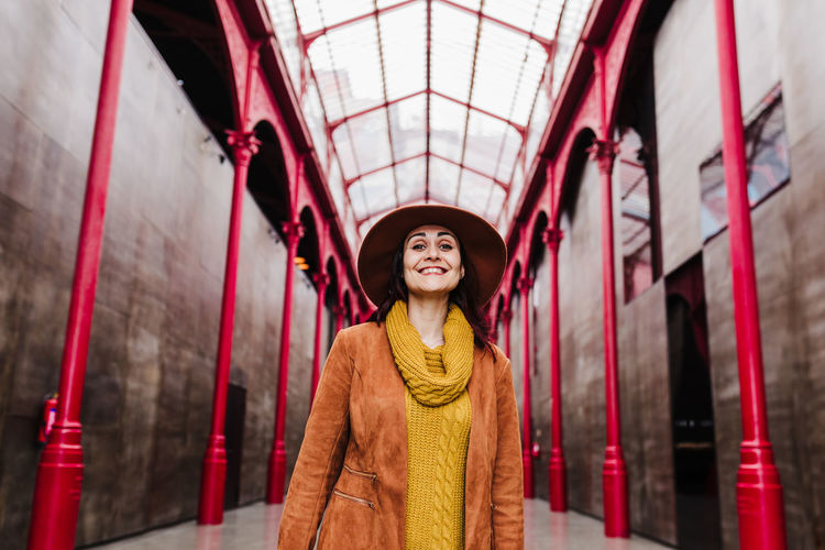 Portrait of smiling young woman standing outdoors