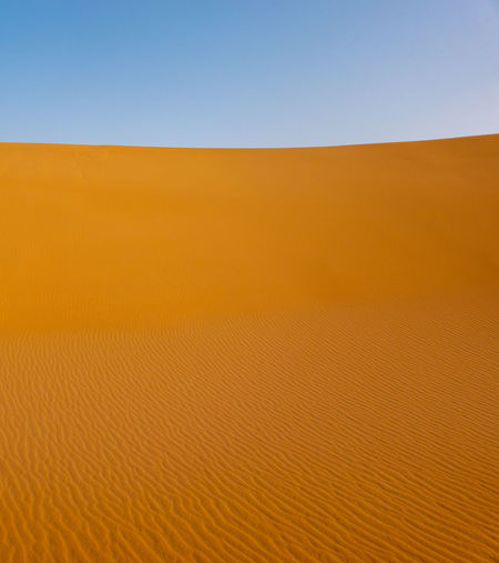 Scenic view of desert against clear sky