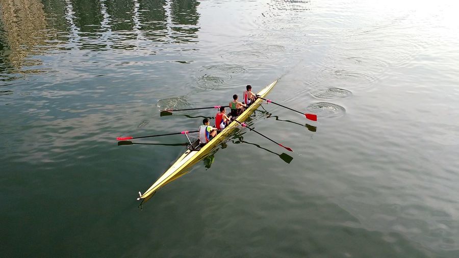 High angle view of men kayaking on river