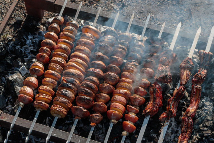 High angle view of meat on barbecue grill