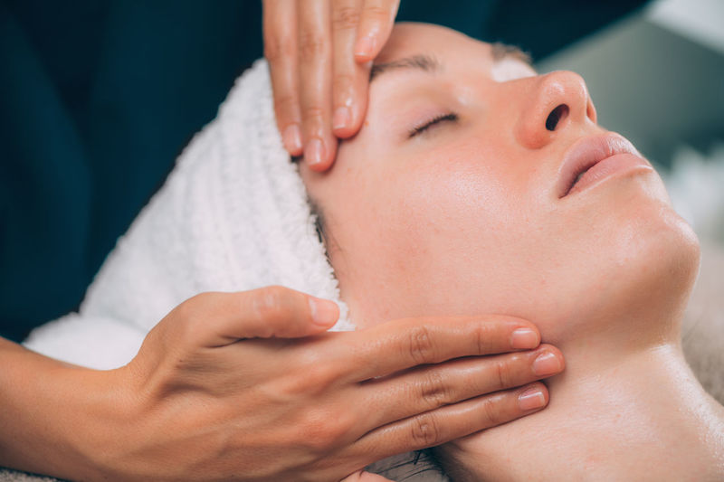 Close-up of woman getting massage therapy at spa