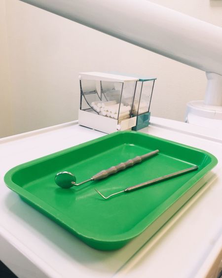 Close-up of dental equipment on table