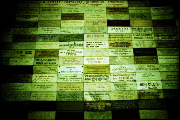 Full frame of nameplates on wall