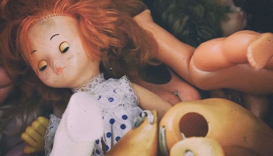 Close-up of abandoned dolls