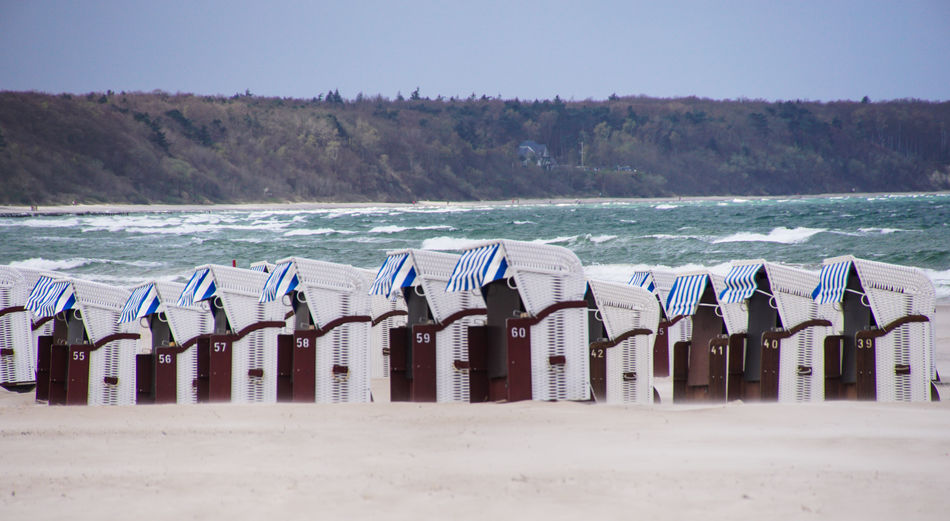 Hooded beach chairs by sea