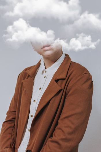 Digital composite image of woman with cloud