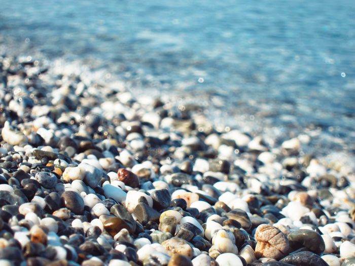 Close-up of pebbles on beach
