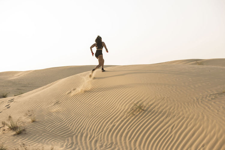 Woman walking in desert