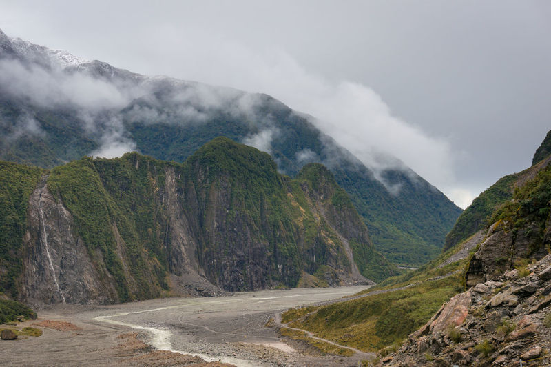 Fox glacier valley landscape with low clouds. hiking in new zealand