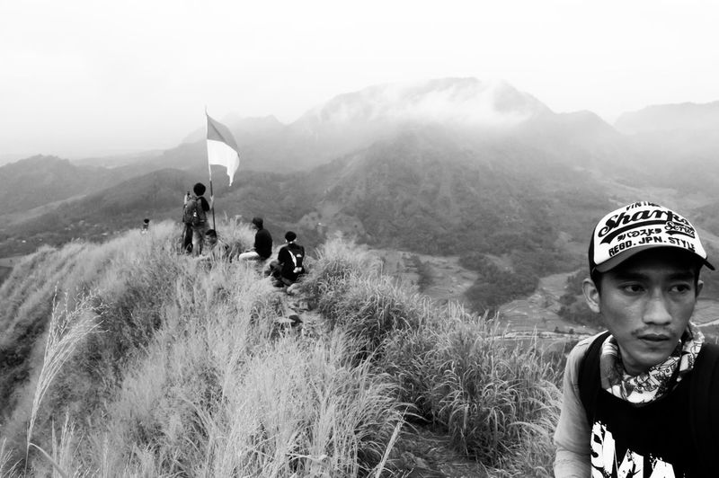 Hikers on mountain with indonesian flag