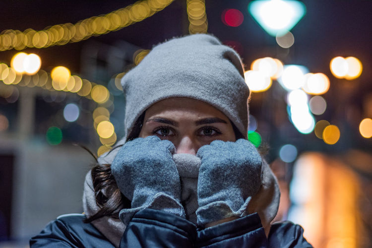 Close-up portrait of woman wearing warm clothing during winter