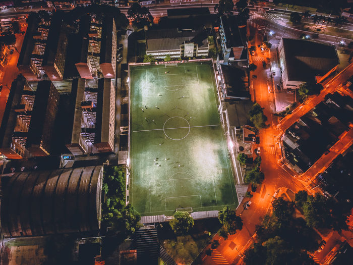 High angle view of playing field in city at night