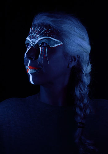 Close-up of woman with fluorescent make-up