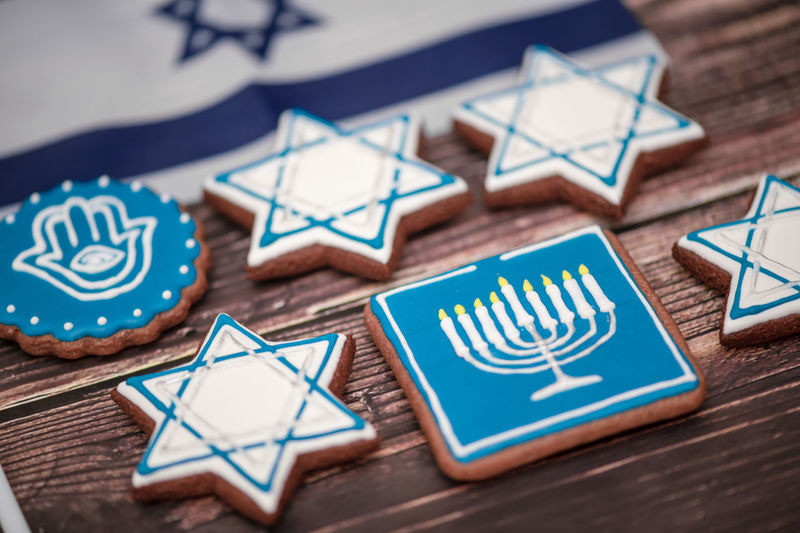 Delicious festive hanukkah cookies for celebrating on a wooden background at home. close-up.