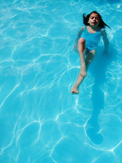 High angle view of girl in swimming in pool