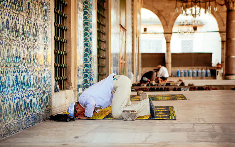 Man offering namaz at mosque