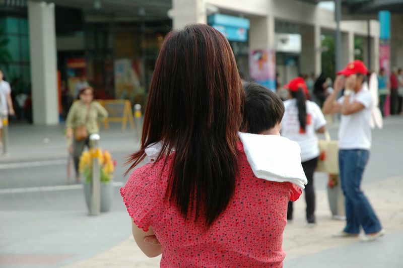 Rear view of women walking on street