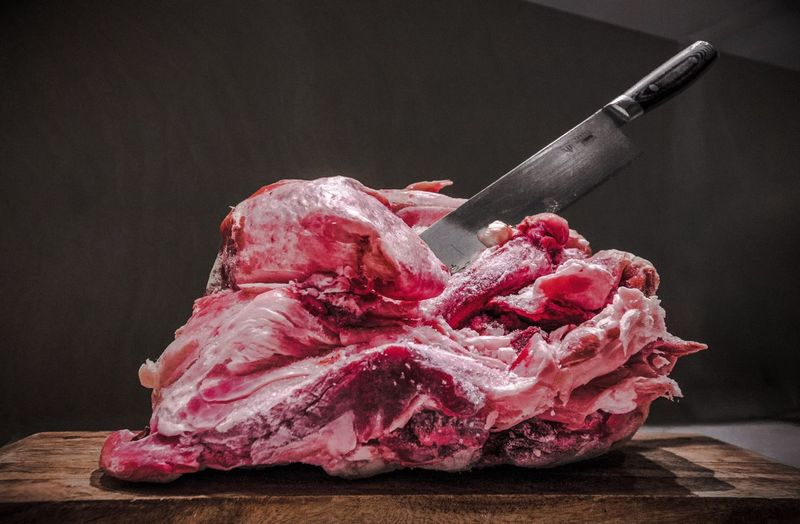 Close-up of beef on chopping board